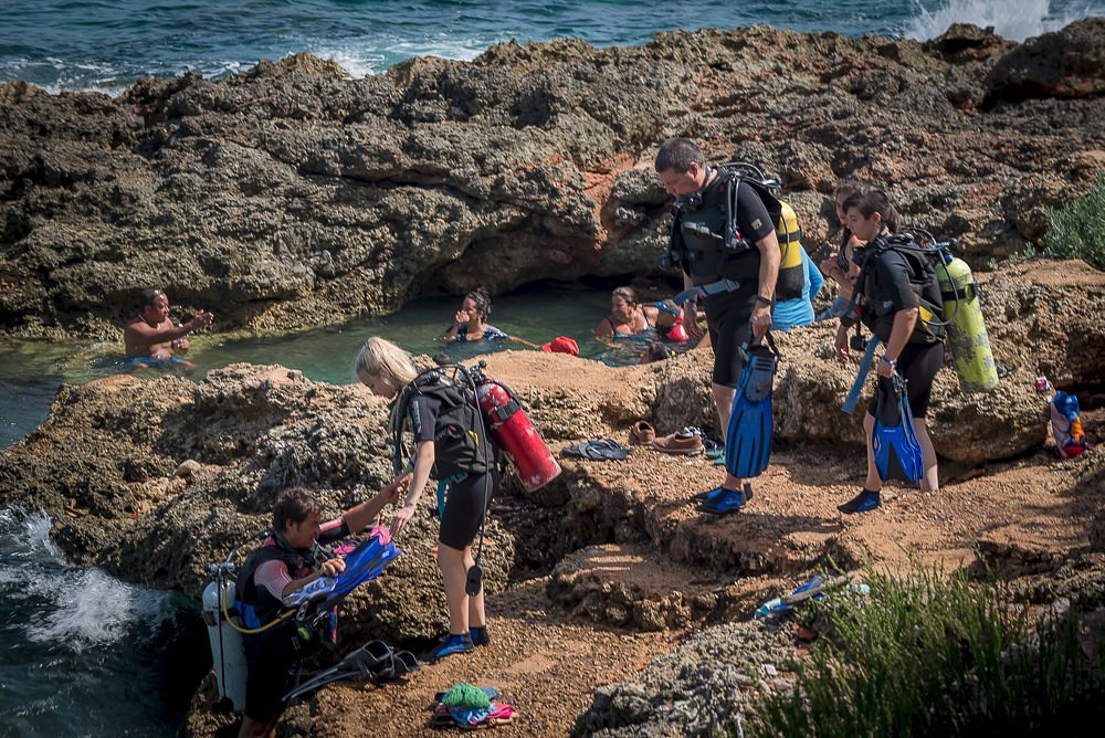 Divers entering the water for a shore dive at Bacunayagua Cuba