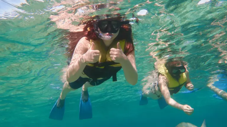 snorkeler-coral-reef-cuba-swiming-with-fish-02
