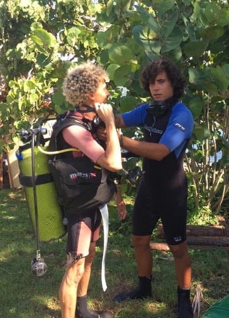 Students practicing buddy checks before entering the water