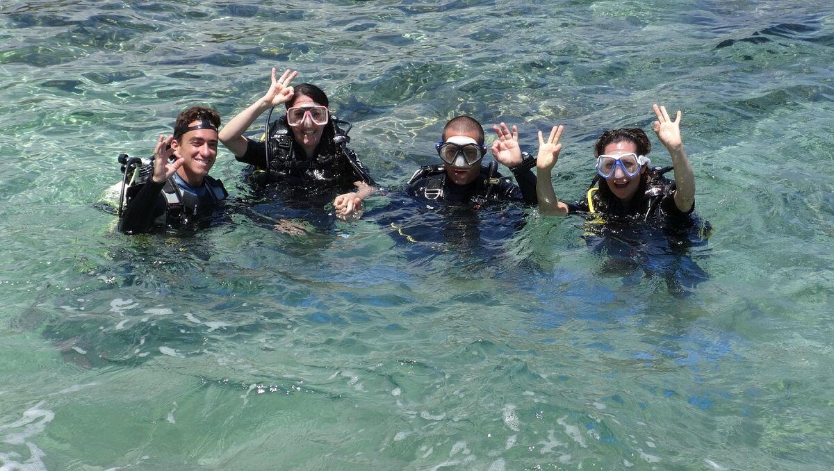 Open Water Diver student surfacing after a successful dive