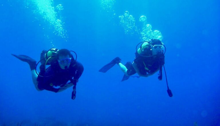 Student hovering underwater during scuba certification training