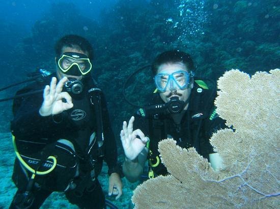 Certified instructor demonstrating underwater hand signals